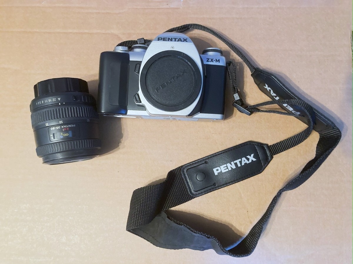 pentax zx-m 35mm film camera, lens, zoom lens, case, flash, film