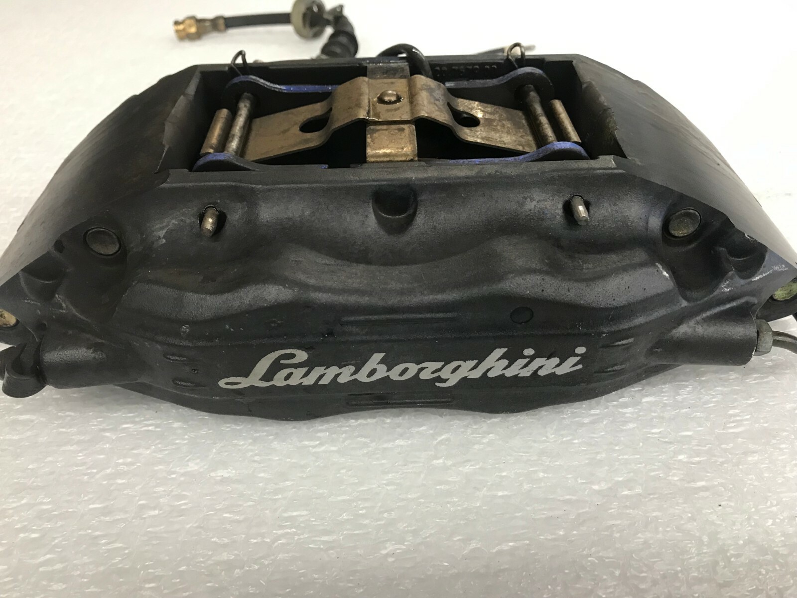 LAMBORGHINI MURCIELAGO FRONT LEFT DRIVER LH BRAKE CALIPER W/ LOGO OEM 0031008999
