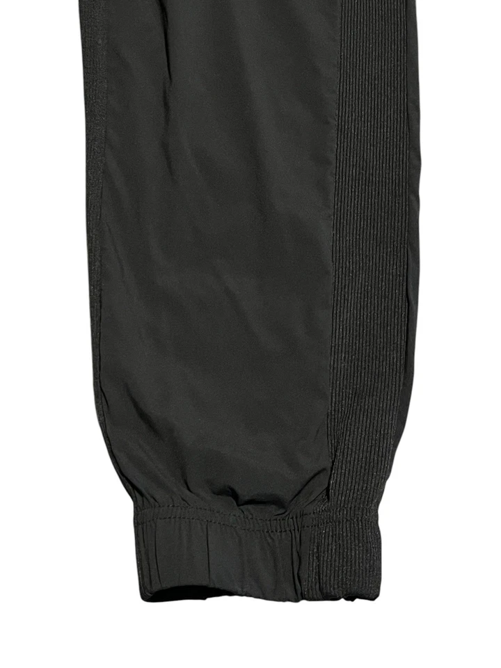 Leggings Hurley para mujer talla mediana negros con bolsillos pantalones deportivos elásticos al tobillo Foto 4 de 4