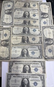 Lot of 12 1957 $1 Silver Certificates circulated