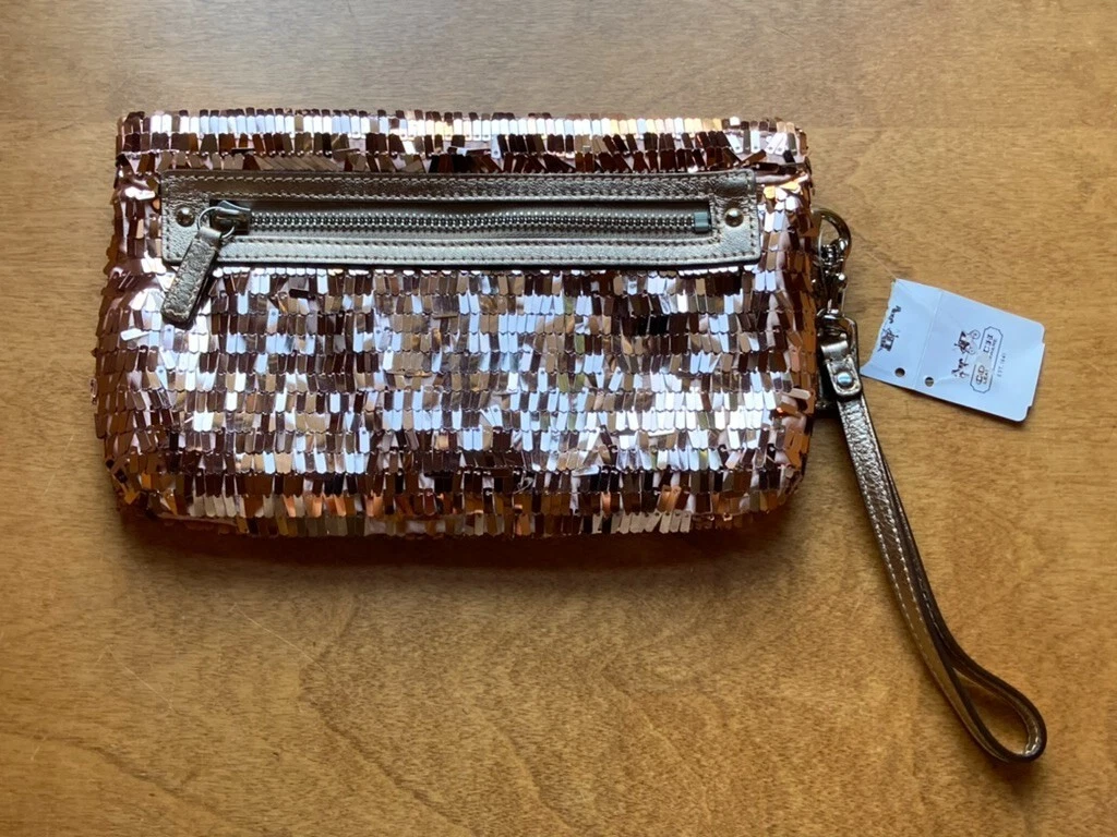 Borsa da polso Coach in pelletteria artigianale paillettes oro rosa nuova con etichette