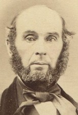 BALDING MAN WITH ODD EYES AND THICK BEARD. MANCHESTER, N.H.