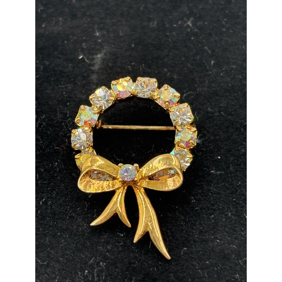 Broche de coroa de flores tom dourado com strass e arco - Imagem 2 de 4