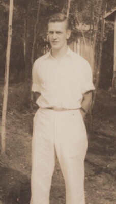 1950s Handsome Man Standing Woods White Shirt Pants Trees Cabin Behind