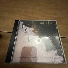 CD The Water Standing On The Shore Of The Cosmic Ocean 