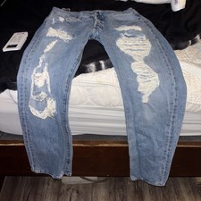 Men's Worn and faded and ripped Levi 501 Jeans Size 31 X 30