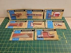 8 VINTAGE MARX POCKET TOOLS IN PACKAGES ON CARD. (P2)