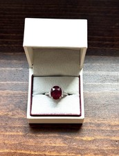 Silver Ring with Oval Ruby Prong Setting and Accent Stones