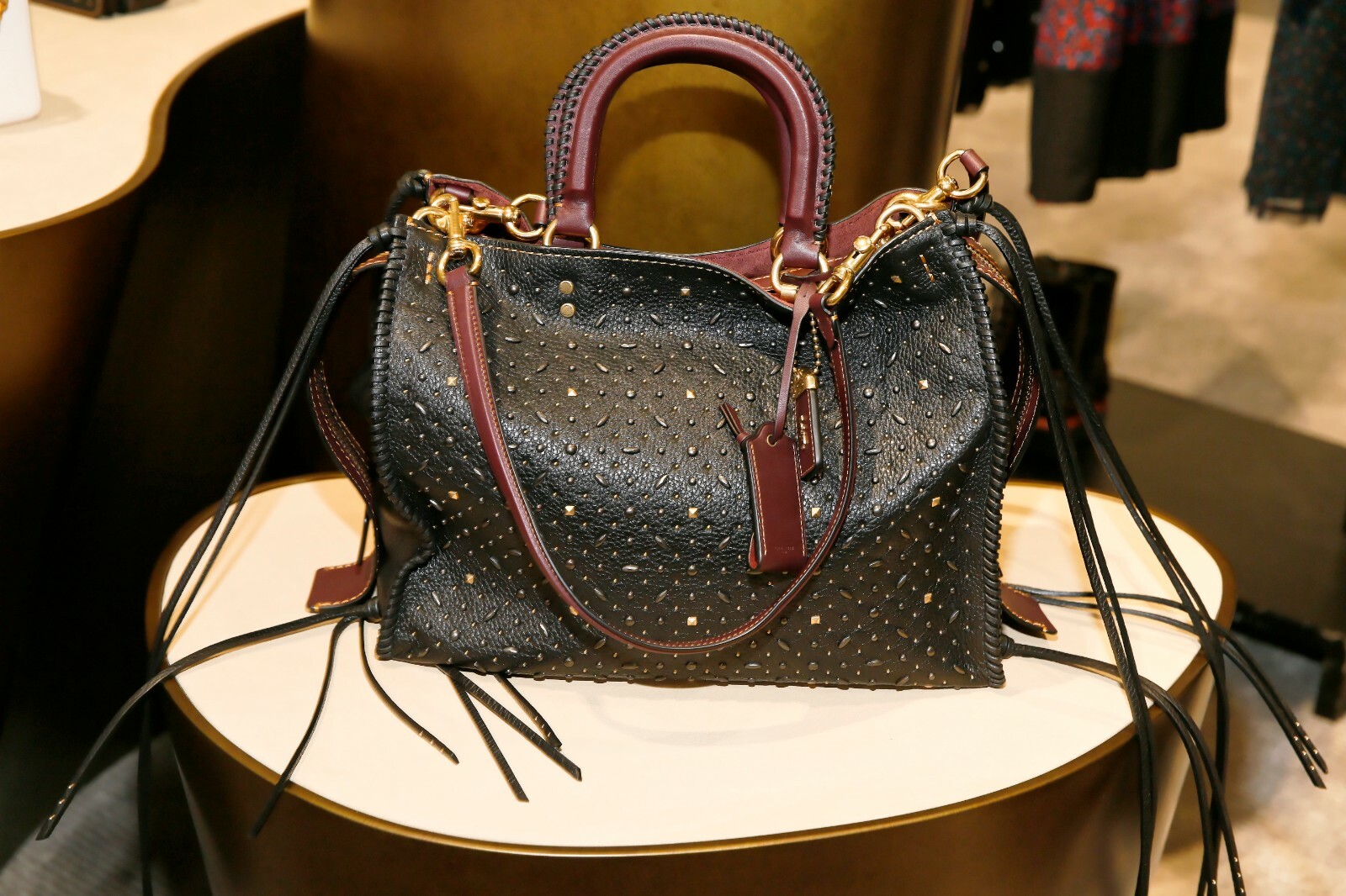 coach rogue with rivets