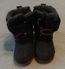 Thermolite Kids Snow Boots Sz. 4 with a strap, laces and a zipper