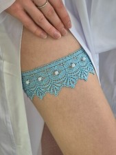Blue wedding garter lace decorated with white beads, handmade