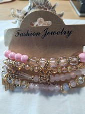Ladies set of 4 fashion bracelets, pinks. golds, butterflies, so pretty, new(5).