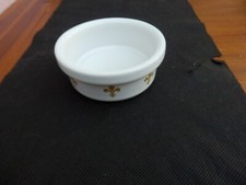 Wade white mini dish with the gold color Fleur-De-Lis pattern around the side 