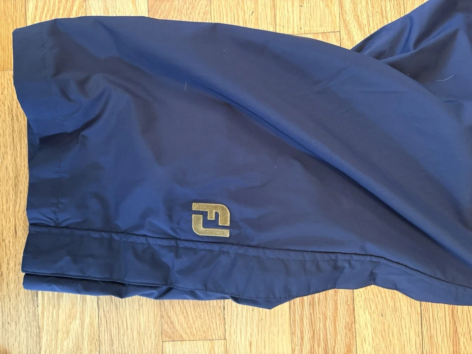 Pantalones de lluvia impermeables de golf FootJoy Dryjoys para hombre azules, medianos, cremallera lateral Foto 2 de 4