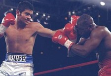 Jesus Ruiz and Calvin Combs throw punches at each other at a fight- Old Photo
