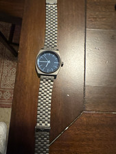 Nixon Minimal Time Teller Quartz Analog turquoise Dial Gray SS Bracelet 100m
