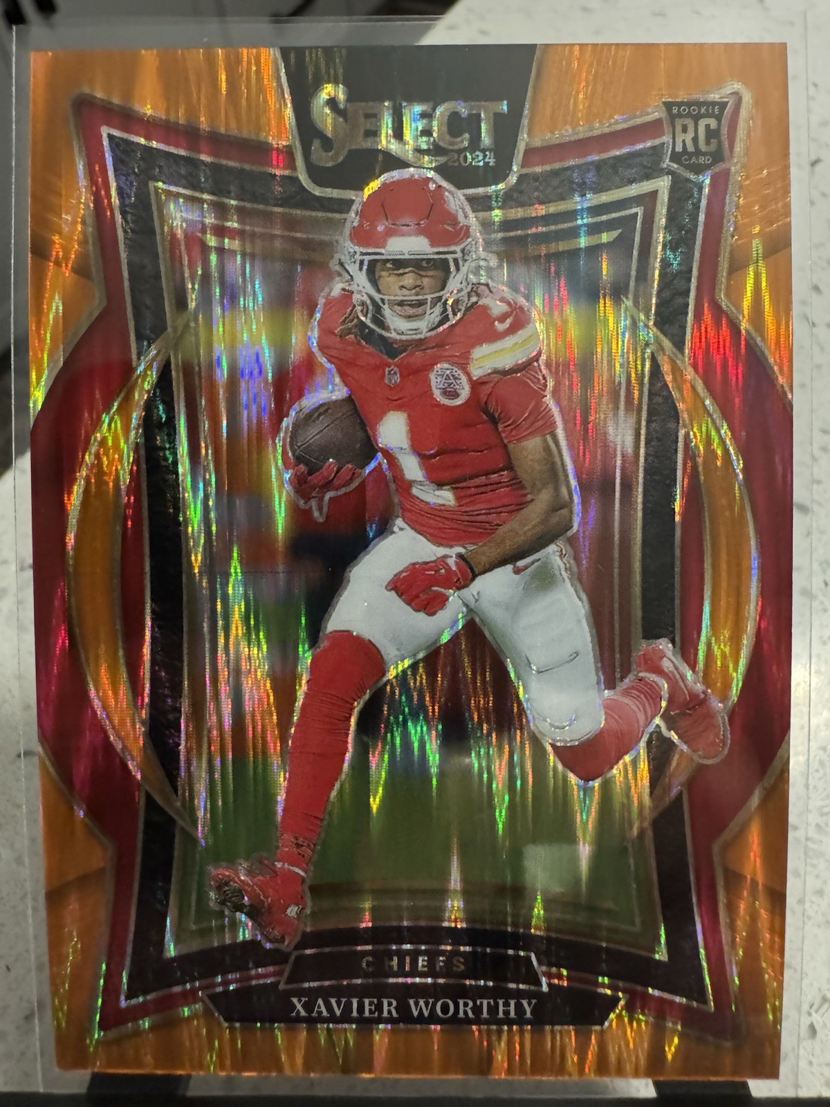 2024 Panini Select - Concourse Xavier Worthy #32 Orange Shock Prizm /499 (RC)