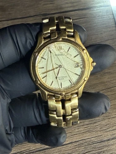 Vintage Seiko 7N32-0049 gold tone champagne dial watch 36mm date round