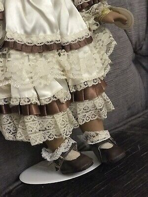 Leonardo collectors porcelain doll Brown Doll With Lace Leonardo collectors porcelain doll Brown Doll With Lace