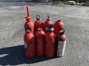 8 MSR Fuel Canisters and 2 Pumps