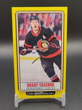 2021-22 O-Pee-Chee #P-24 Brady Tkachuk O-Pee-Chee-Premier-Tallboys-Yellow-Border