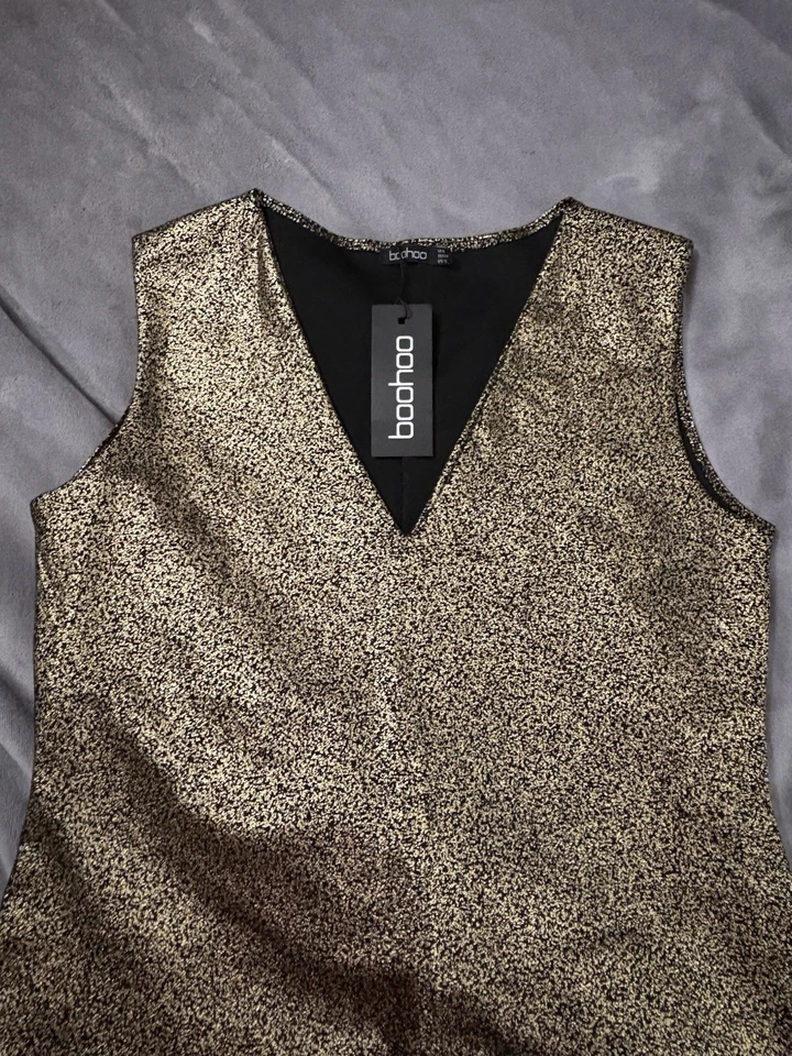 Vestido elástico marca Boohoo negro y dorado metálico. Talla 12 US. Reino Unido 16. 44 euros Foto 3 de 4