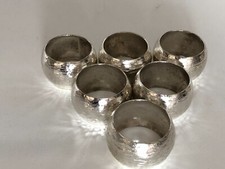 UNCASED SET OF 6 SILVER PLATED AND PLANISHED NAPKIN RINGS (NR-JJ)