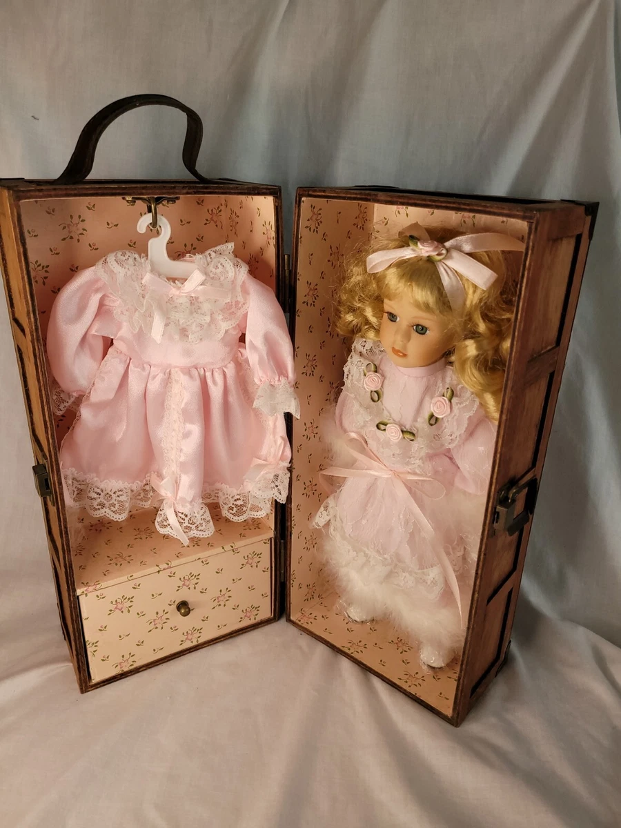 Porcelain doll in cheap wooden box