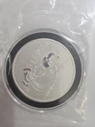 Peanuts® Lucy Pulls the Football 1 oz Silver Round Package Opened