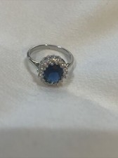 Silver Ring with Blue stone, Circled By CZ Stones, ladies size 9