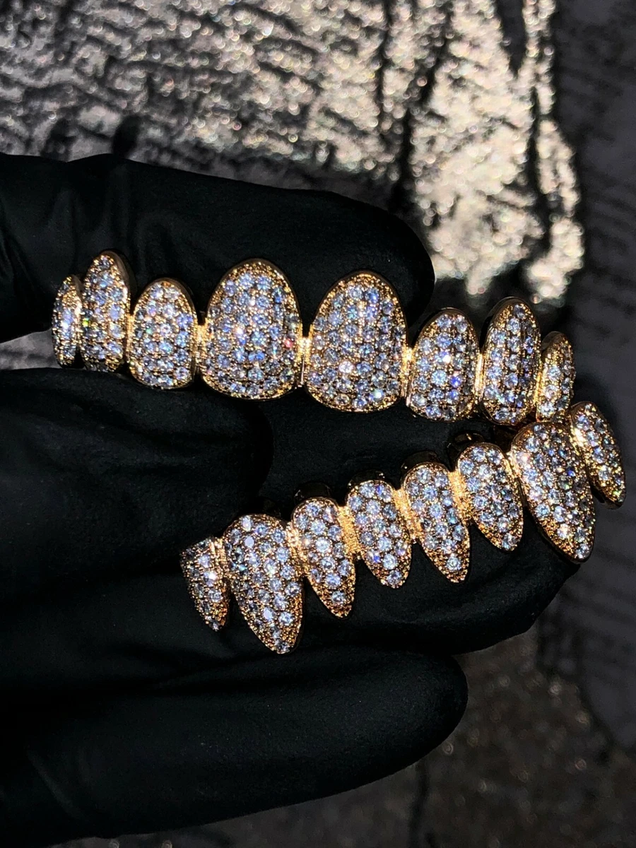 Iced out shop grillz in mouth