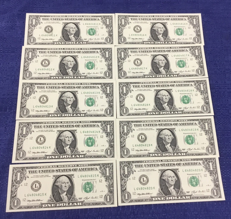 1993 $1 INK SMEAR ERROR of DISTRICT SEAL as part of 10 CONSECUTIVE UNC. NOTES