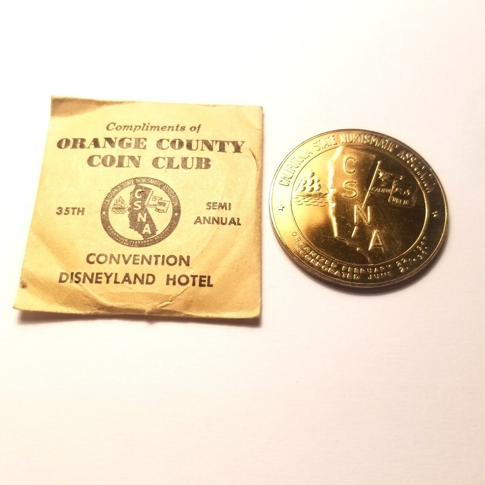 1964 ORANGE COUNTY COIN CLUB CSNA CONVENTION DISNEYLAND HOTEL MEDAL GEM