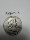 1958-D circulated 90% silver Franklin half dollar.