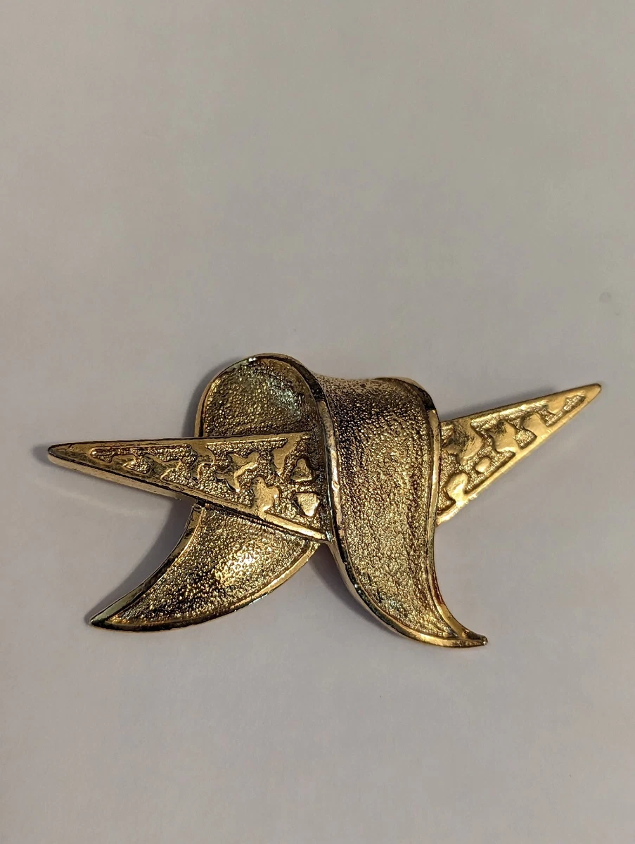 Branded brooch on sale