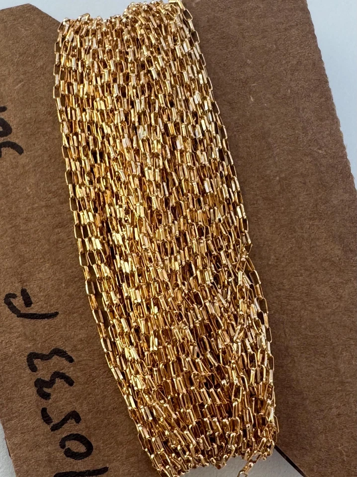 Cadena enrollable ovalada plana de 1,4 mm x 3,5 mm rellena de oro amarillo 14K a pie (C10533F) Foto 4 de 4