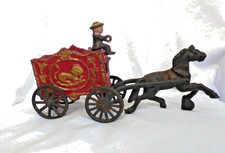 Cast iron horse-drawn red lion circus wagon with driver 9 long; one horse