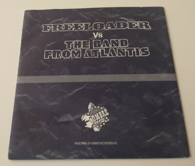 FREELOADER VERSUS THE BAND FROM ATLANTIS VINYL 7'' OUT OF CONTROL/LOST & FOUND.