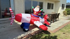 Christmas Inflatable Lighted Santa Claus Flyi...