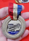 CIVIL WAR VETERANS 1915 GAR AKRON OHIO ENCAMPMENT RUBBER TIRE BADGE W/ RIBBON