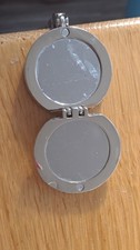 HANDBAG BUTLER fir table vgc  cat design with mirror compact . Silver colour 