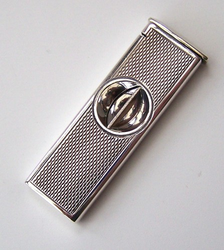 ZIGARRENSCHNEIDER AUS STERLINGSILBER 1988. MOTOR GEDREHTE DEKORATION. ARI D NORMAN