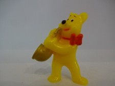 Spielfigur mit Musikinstrument / Bär mit Saxophon
