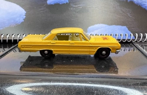 Lesney Matchbox 20c; Chevrolet Impala Taxi; Dk Yellow, Silver Base, White Seats