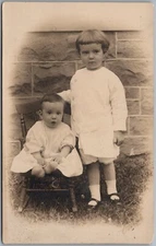 Little Girl w/ Baby Brother Or Sister Stone Wall RPPC Real Photo Postcard D576