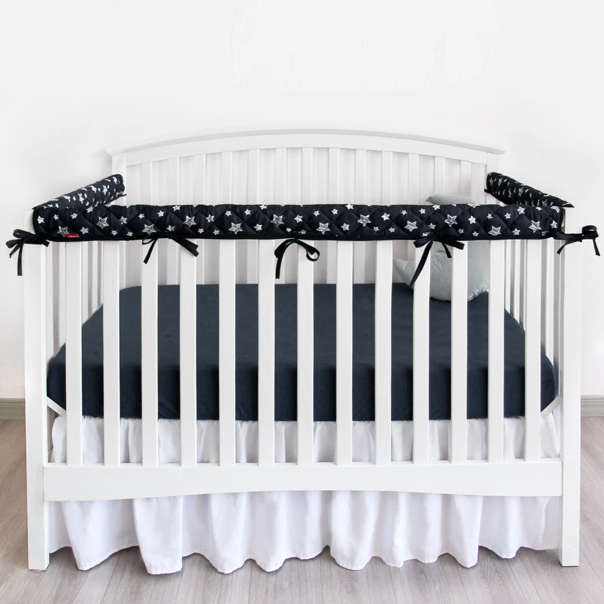 Crib bedding with rail covers top