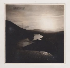 Bridge Silhouette Over Sunlit Bay with Distant Clouds Painting the Sky Abstract