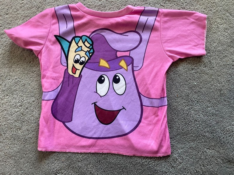 Girls Dora The Explorer T-shirt, Size 3-5. Measures 15 in W, 16 L.