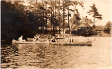 People Rowing Boats near Shore Unknown Location 1910s RPPC Scenic Postcard