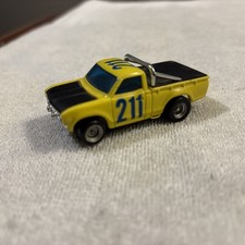 AFX Datsun Baja yellow running chassis  
